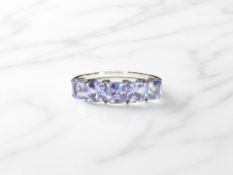 A 9ct white gold tanzanite ring, size R. CONDITION REPORT: 2.