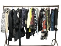 A rail of lady's clothing including oriental silk jackets, various other jackets and blazers,