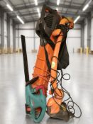 A Flymo garden vacuum, a strimmer and a Bosch hedge trimmer.