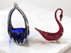 A red glass Whitefriars swan, height 20 cm, together with a cobalt blue Murano basket.