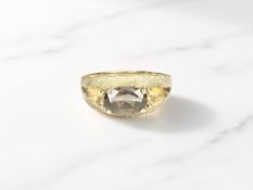 A 9ct yellow gold ring set with a smoky quartz, size R. CONDITION REPORT: 3.45g.