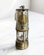 An Eccles Type GR6S brass and chrome miner's safety lamp.
