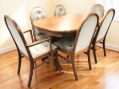 A teak oval extending dining table with internal leaf, unextended 145 cm x 105 cm x 77 cm,