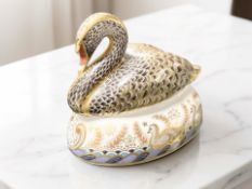 A Royal Crown Derby Black Swan paperweight, limited edition No. 808 of 2002, gold stopper.