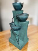 A contemporary composition water feature, with power lead, height 71 cm.