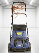 A Hyundai electric lawn sweeper.