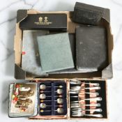 A group of cutlery boxes, coffee spoons, cake forks, Arthur Price berry spoon, etc,