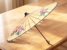 A large oriental parasol, diameter 100 cm.