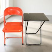 An enameled metal folding chair and a similar table.