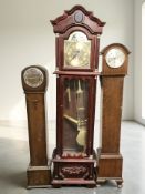 A reproduction longcase clock with brass dial signed 'Daniel Dakota', height 181 cm,