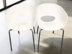 A pair of Orbit Large by Sinestri moulded plastic chairs on chrome legs, width 53 cm.