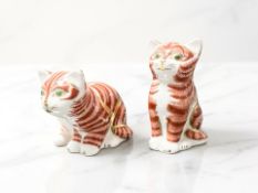 Two Royal Crown Derby seated cat paperweights, with gold stoppers.