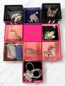 Ten pieces of Butler & Wilson costume jewellery including dragon, peacock and flamingo brooches,