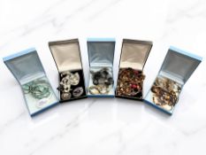 A group of costume jewellery to include polished bead necklace, pendants, etc.