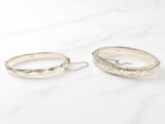 Two silver bangles CONDITION REPORT: 38.