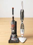 A Vax vacuum cleaner and a further steam cleaner.