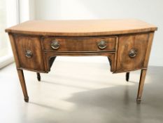 A George III style mahogany bow front sideboard, late 19th century, 138 cm x 67 cm x 87 cm.