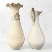 A large earthenware flared rim vase with ring handles, height 82 cm, plus a similar jug.