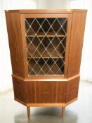 A 20th century Danish teak leaded glass door corner cabinet, height 140 cm.