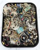A tray containing a large quantity of costume jewellery.