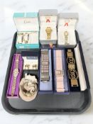 A collection of boxed fashion wristwatches including Marcel Drucker, Limit, Storm,