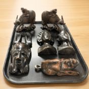 A pair of Chinese carved wooden groups modelled as figures astride water buffalo, length 16 cm,