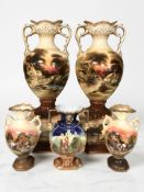 A large pair of lustre ware urns depicting rural landscapes,