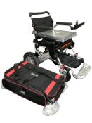 A Foldalite Trekker power assisted wheelchair, with accessories and ramp.