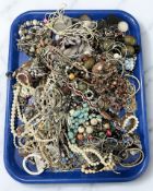 A tray containing a large quantity of costume jewellery.