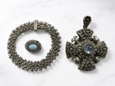 A cross pendant with filigree work and central cabochon, marked Jerusalem Silver 900 to reverse,