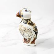 A Royal Crown Derby Puffin paperweight, gold stopper.