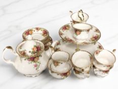 Twenty one pieces of Royal Albert Old Country Roses tea china including teapot and cake stand.