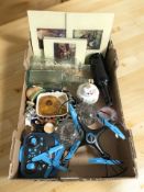 A group of glass paperweights, bottles, prints, remote control helicopter, other ceramics.