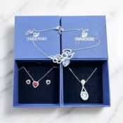 A Swarovski crystal heart-shaped pendant and matching earrings,