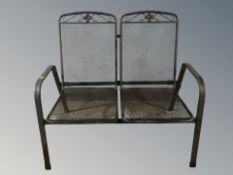 A modern wire metal two seater garden bench, width 106 cm.