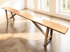 A 19th century French fruitwood farmhouse bench, 201 cm long.