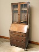 An early 20th century bureau bookcase, width 75 cm.