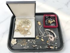 A Butler & Wilson encrusted dachshund brooch, together with faux pearl and other costume jewellery.