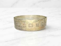 A silver bangle, Bracelon Ltd, Birmingham 1977, inner diameter 6cm.