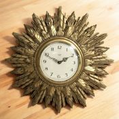A Smiths Sectric gilt sunburst wall timepiece, with electronic movement, diameter 48 cm.