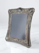 An Elizabeth II silver-mounted easel photograph frame, in the Art Nouveau style, D R & S,