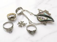 A 9ct gold plated silver dress ring together with three further Sterling silver rings,