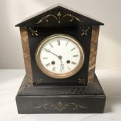 A Victorian black slate mantel clock