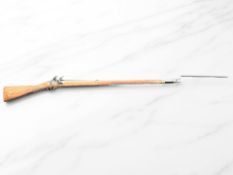 A modern non-firing copy of a British Napoleonic-era musket, with triangular socket bayonet,