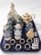 A group of ceramics and china including continental figures, teapot, napkin rings,