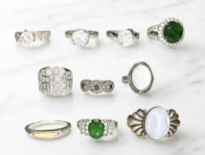 Ten sterling silver rings, each set with synthetic stones.