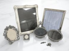 A group of silver-plated easel photograph frames, tallest 31cm.