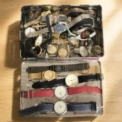 A tin containing a quantity of wristwatches including Pulsar, Smiths, Carvel, Rado, Calvin Klein,