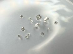 Thirteen loose brilliant-cut diamonds, the largest stone weighing approximately 0.