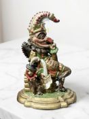 An antique cast iron Mr Punch door stop,